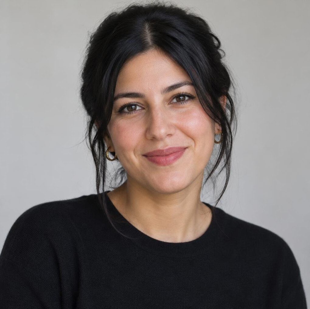 Portrait of a woman with dark hair smiling